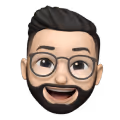 Smiling male emoji with glasses, beard, and slicked-back hair.