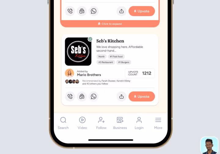 Mobile app interface showing a restaurant profile for Seb's Kitchen with buttons for calling, messaging, sharing, and an upvote count of 1212, plus navigation icons at the bottom.