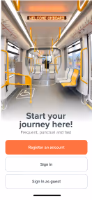 Interior of a modern, empty train with yellow handrails and seats, displaying a sign that reads 'Welcome onboard.'